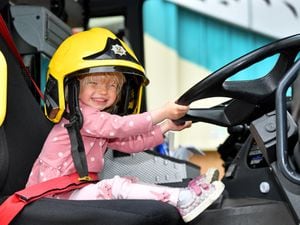Bishop's Castle Community Celebration Day at SpArC Theatre, Bishops Castle. Olivia Edwards, aged two, has early aspirations to be a firefighter!