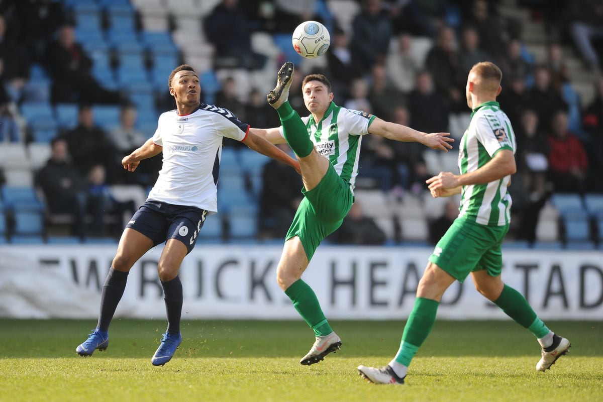 Marcus Dinanga battles for the ball Kieran Green during the Vanarama National League North fixture between AFC Telford United and Blyth Spartans at the New Bucks Head.