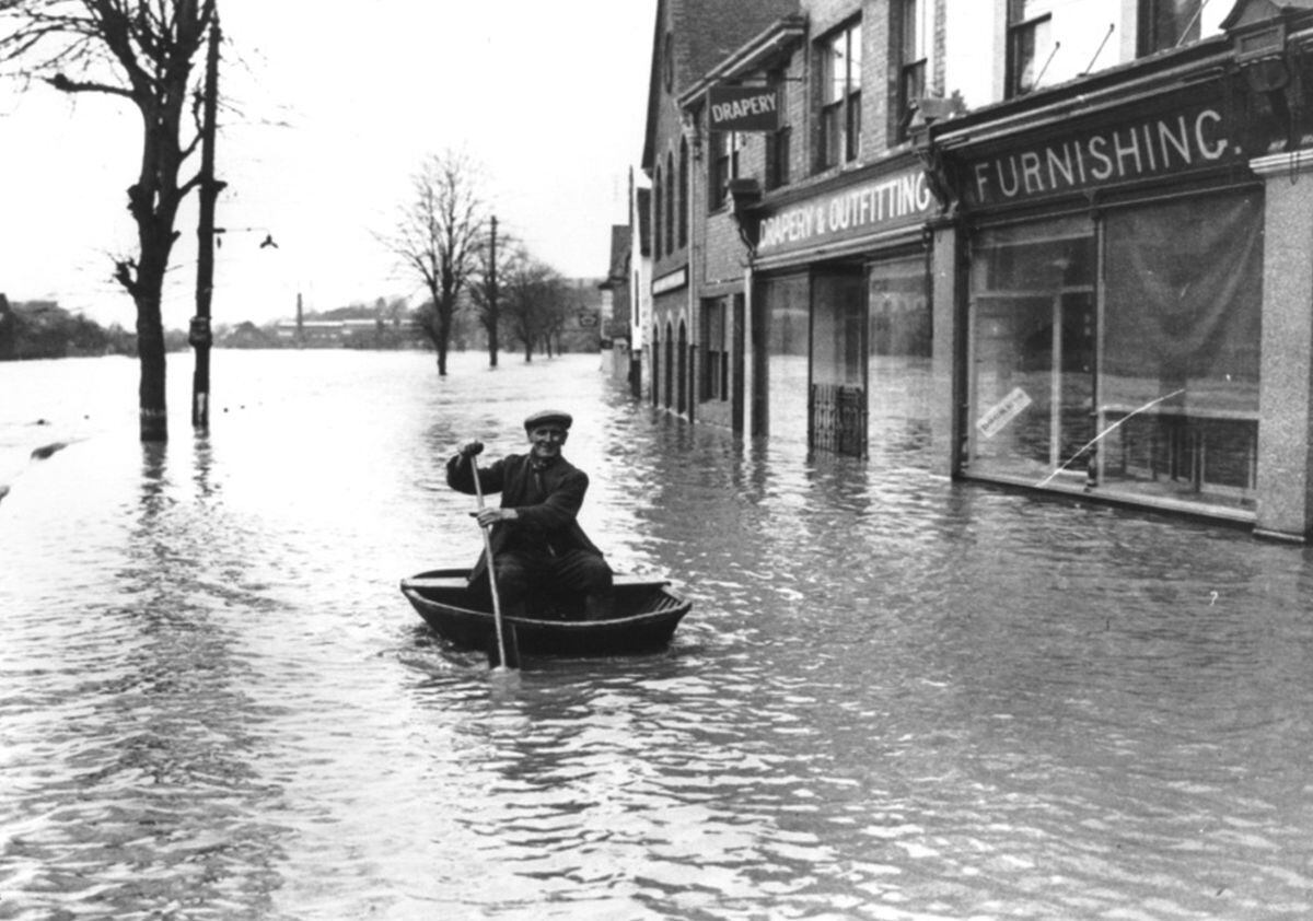 Coracle man Harry Rogers gets about in the flooded Wharfage, Ironbridge, in 1947.