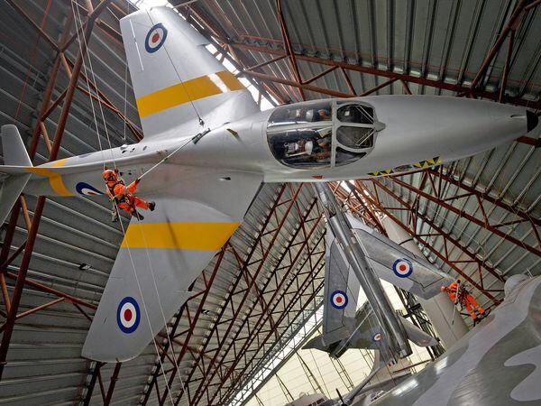 You have to have a head for heights and an eye for patches of dust when cleaning fighter jets hanging from the ceiling of the RAF Museum at Cosford