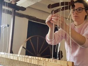 Weaver in residence Kay-lee Davies at work on a loom at Newtown Textile Museum.