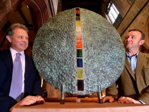 Paul Kennedy from Acton Round is pictured with Lord Gavin Hamilton and the sculpture