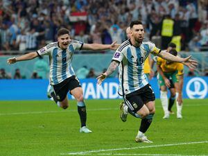 Lionel Messi, right, celebrates after firing Argentina into a first-half lead against Australia