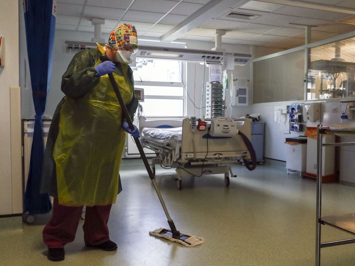 File photo dated 27/5/2020 of a cleaner working on a hospital ward. Hundreds of hospital workers including porters, cleaners and catering staff, are to go on strike in a dispute over pay