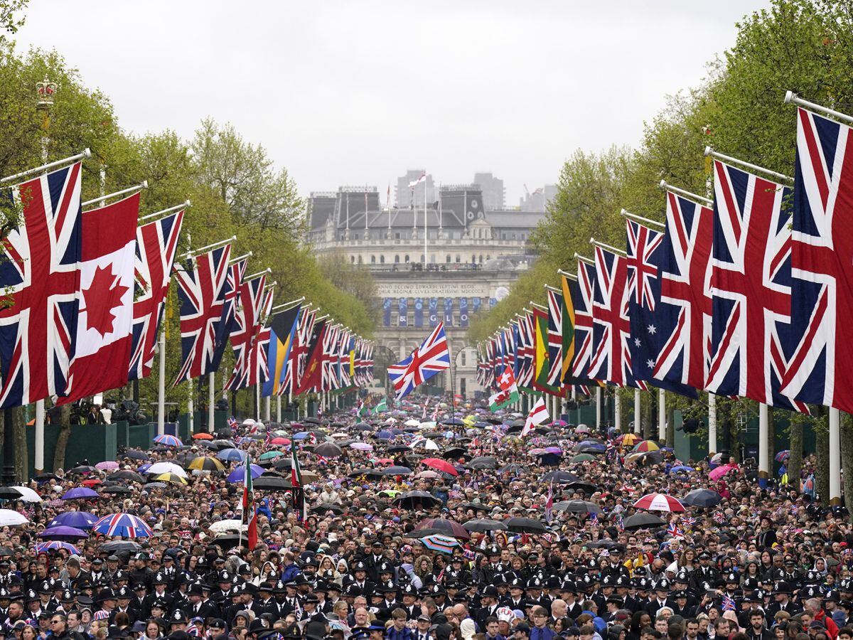 Crowds fill The Mall following the coronation of the King and Queen Camilla