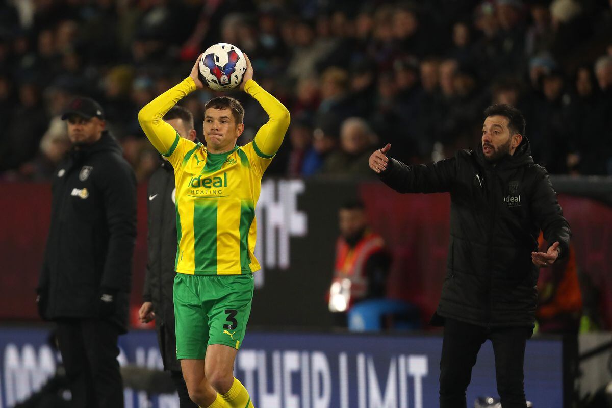 Conor Townsend  of West Bromwich Albion takes a throw whilst watched by Carlos Corberan (Photo by Adam Fradgley/West Bromwich Albion FC via Getty Images).
