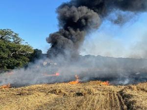 Crews battle a combine harvester fire near Wem on Wednesday