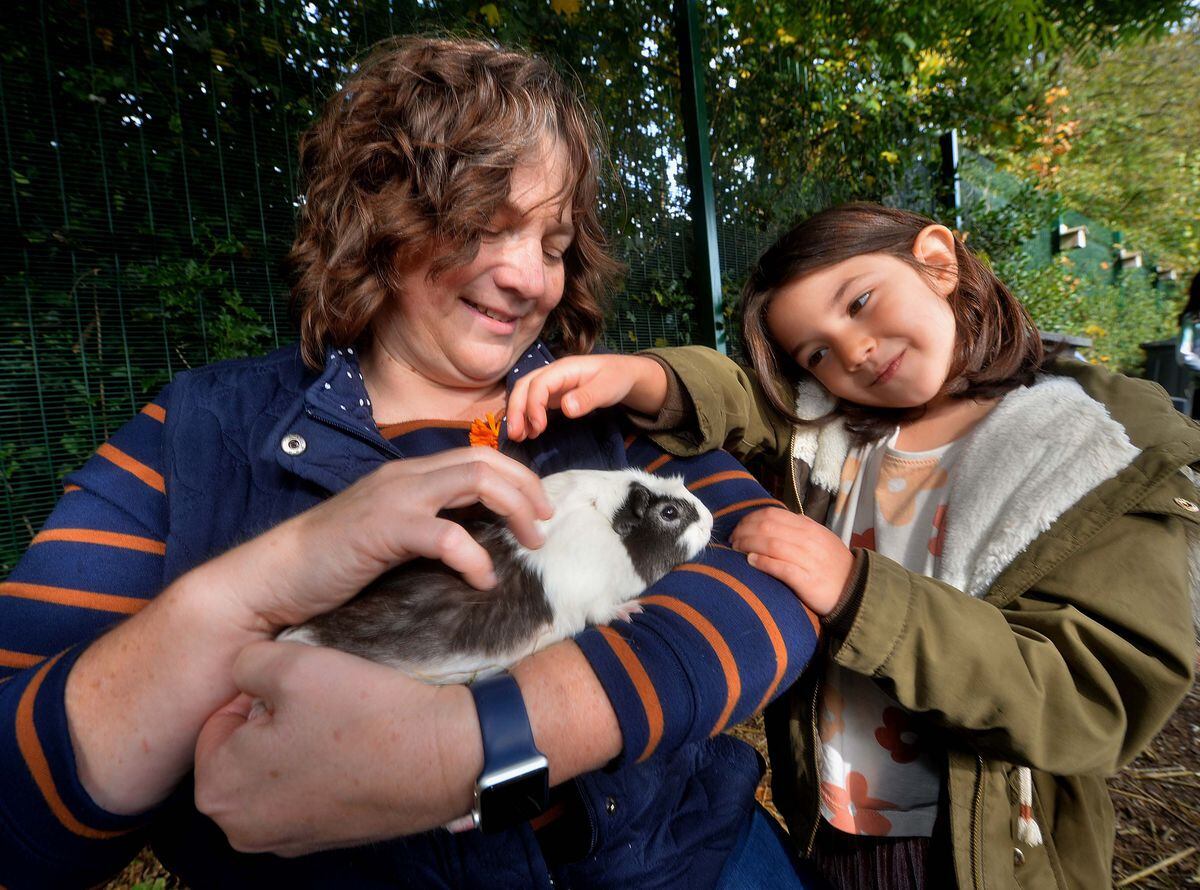  Headteacher Lisa Millington with Koralia Schoina and a guinea pig