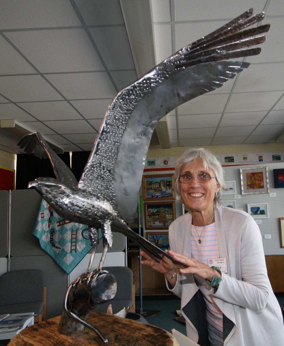 In the craft section at Church Stretton Arts Festival, Sarah Yates admires the kite sculpture, Mild Steel by Timothy Harral. Pic: Lillian Tomlinson