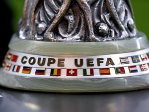 A detailed view of the Europa League trophy on display