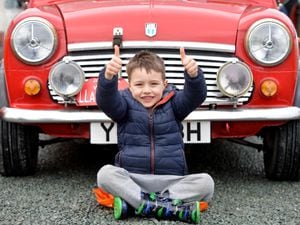 Hundreds of Minis from the Wirral Mini Owners Club converge on the British Ironwork Centre in Oswestry. From Shrewsbury, five-year-old Tommy Barlow.