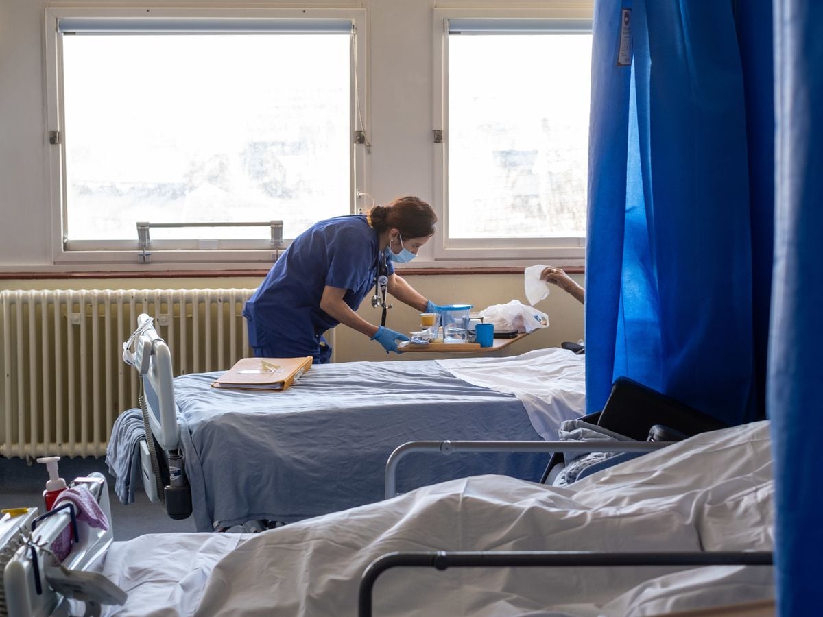 A nurse at work on a ward