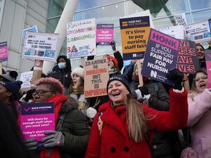 Protesters on a picket line outside University College Hospital, London