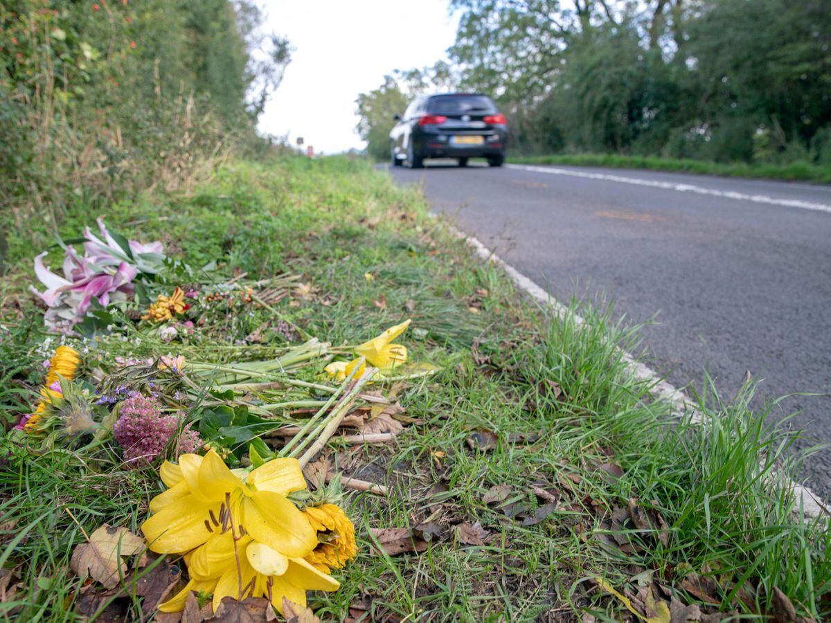 Floral tributes on the B4031 outside RAF Croughton, in Northamptonshire, where Harry Dunn, 19, died when his motorbike was involved in a head-on collision