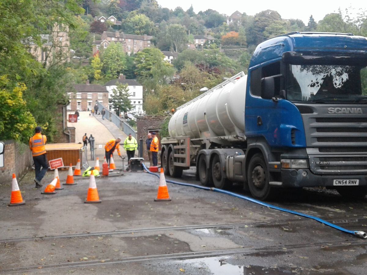 A tanker injects water into pipes in Ironbridge in an attempt to keep homes supplied