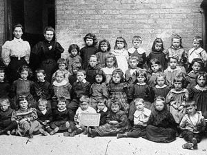 XXXX nostalgia pic. Shrewsbury. Wyle Cop School, Shrewsbury. 'Mother x in front row.' i.e. the girl marked with an x, second from left, front. She was Alice Pemberton, also known apparently as Alice Young Pemberton. Her son was Neville Nelson.  Date unknown. About 1902??  Picture by Belbin, 75 Abbey Foregate, Shrewsbury. School children. Schoolchildren. Class. Classes. Picture loaned by Mrs Pirkko Nelson of Shrewsbury, Mr Nelson's widow.  Shrewsbury school. Schools.  Library code: Shrewsbury nostalgia 2003.