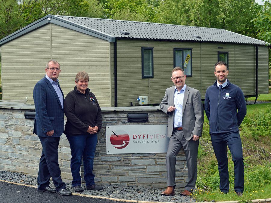 Russell George MS (Third to the right) with Bywater Leisure Parks’ managing director Dylan Roberts (First on the left), associate director Ed Glover (Fair right) and Morben Isaf Holiday Home and Touring Park joint manager Ben and Sarah Lewis.