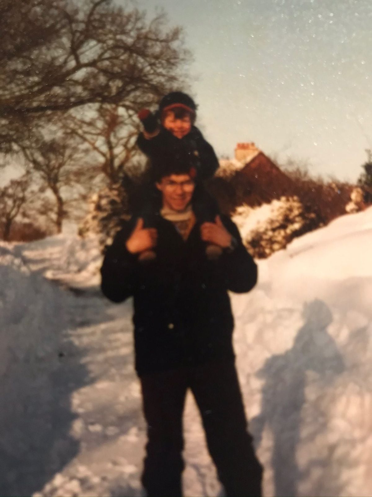 Alex's older brother Tom and Dad Paul in the snow 