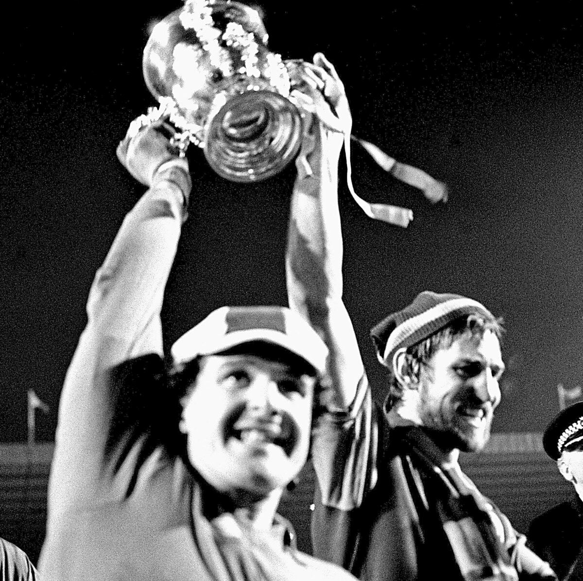 Lifting the League Cup in 1977 with Chris Nicholl, right, while at Villa