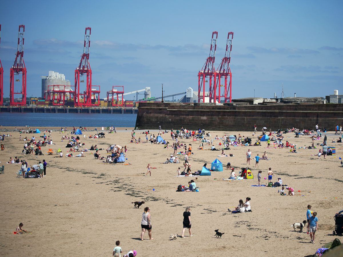 People on the beach at New Brighton