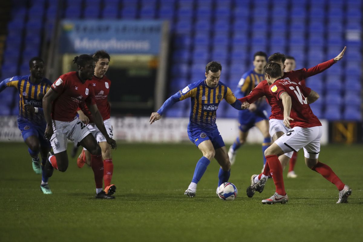Shaun Whalley of Shrewsbury Town is surrounded by Crewe Alexandra defenders. (AMA)