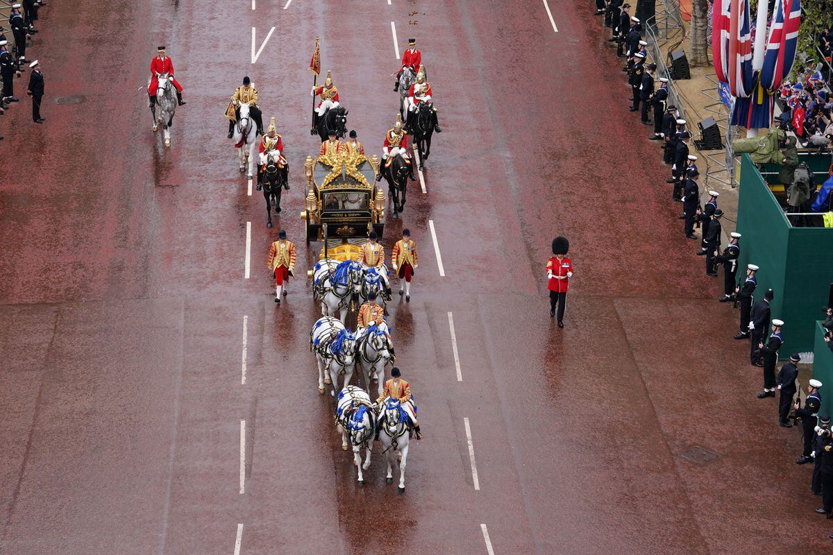 The Diamond Jubilee State Coach, accompanied by the Sovereign's Escort of the Household Cavalry, including Andrew Stokes, travels along The Mall in the King's Procession ahead of the coronation ceremony of King Charles III and Queen Camilla in central London. 
