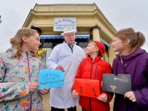 Butcher Granville Elson gets cards from Coleham Primary School pupils