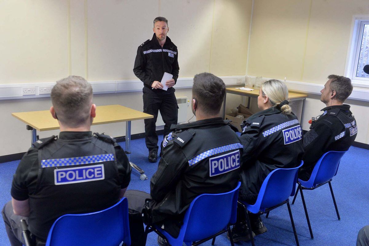Police officers are briefed about Operation Justice