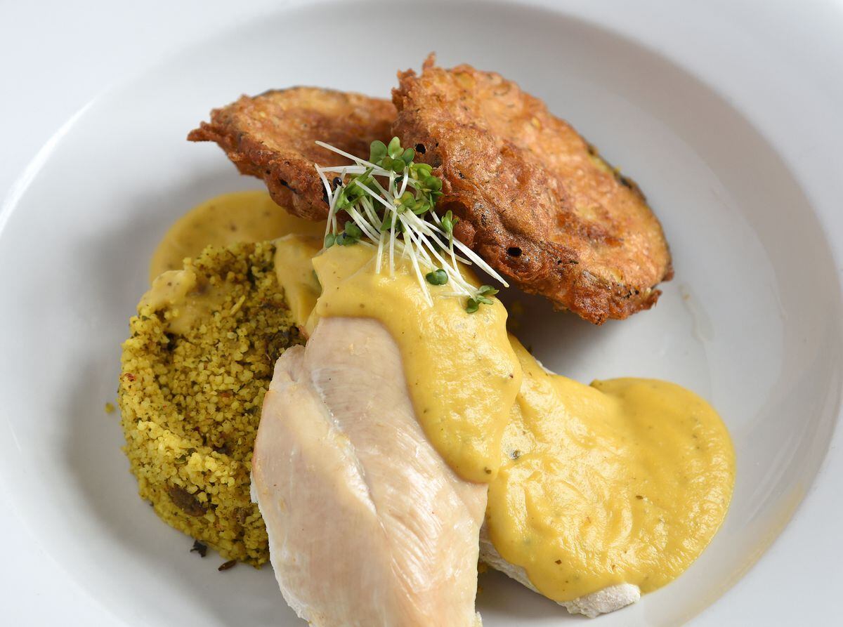 Breast of chicken, apricot and coriander sauce, spiced couscous, aubergine fritters