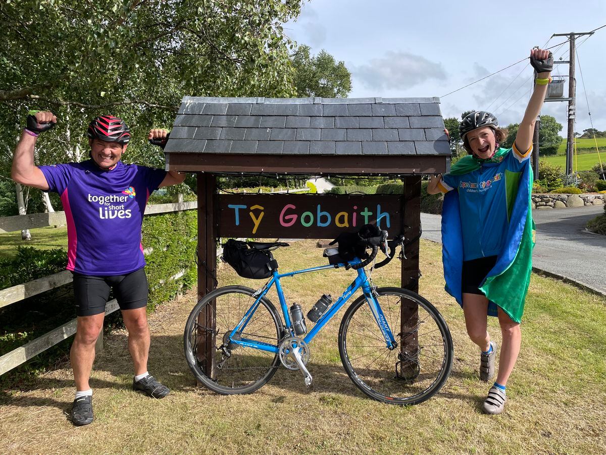 Francesca and cycling partner Tony are welcomed to Tŷ Gobaith