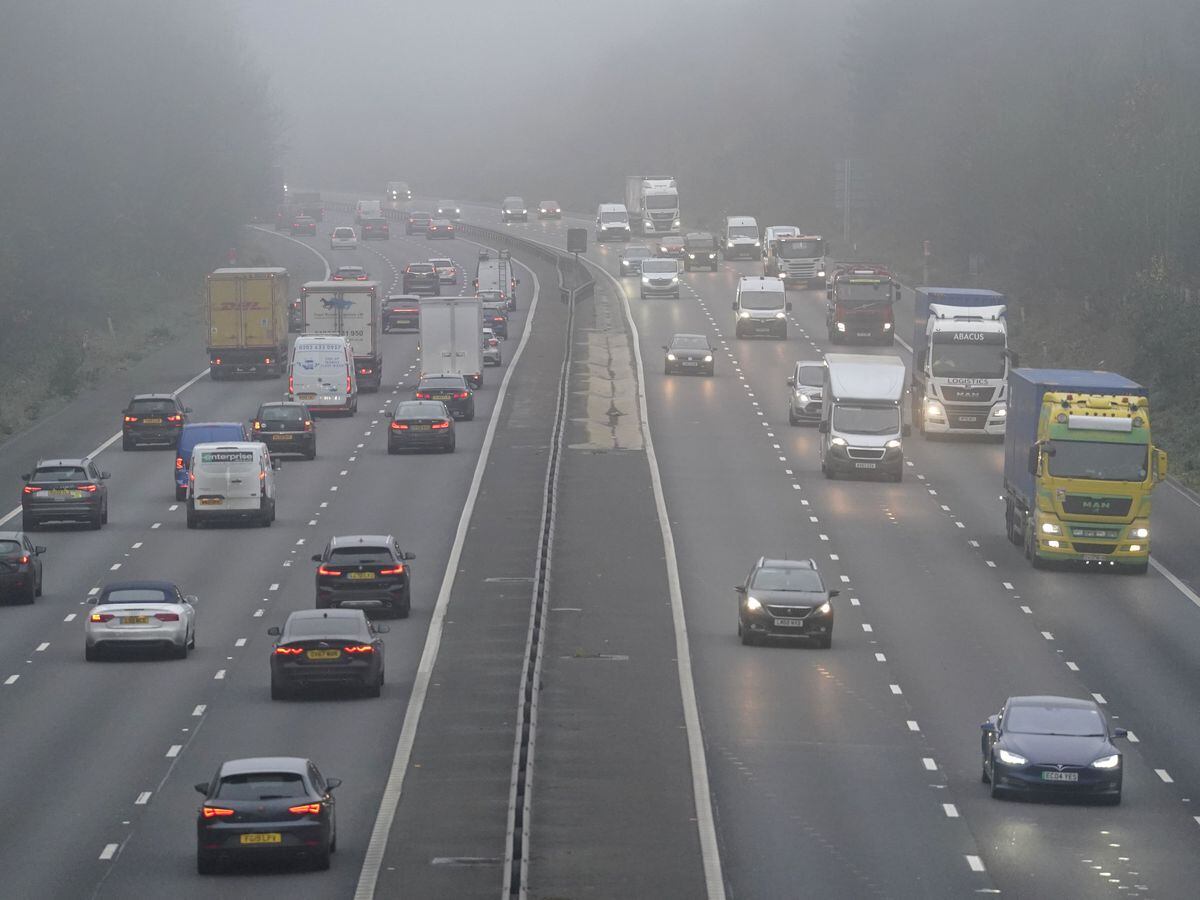 Vehicles drive through fog on the M3 near to Old Basing in Hampshire