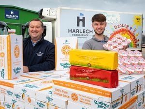Harlech Foodservice Director Mark Lawton, left, and Toby Foskett with a schools shipment including Radnor Hills water, Dragon cheese from South Caernarfon Creameries and Llaeth y Llan yoghurt. Picture: Mandy Jones 