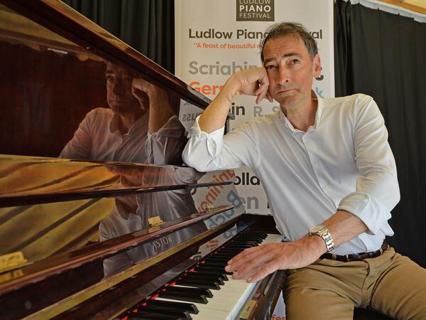 File picture of Alistair McGowan playing piano at Fringe community piano, Ludlow