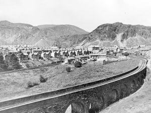 nostalgia pic. Blaenau Ffestiniog. The small town of Blaenau Ffestiniog in Wales in 1968 with a railway viaduct in the foreground. This is a print in the Shropshire Star picture archive and the photographer was John Tibbott whose datestamp is for September 5, 1968. The print has the Shropshire Star copyright stamp. Blaenau Ffestiniog is known particularly for its slate mines and slate mining. Blaenau Ffestiniog general view, landscape, panorama. Library code: Blaenau Ffestiniog nostalgia 2022..