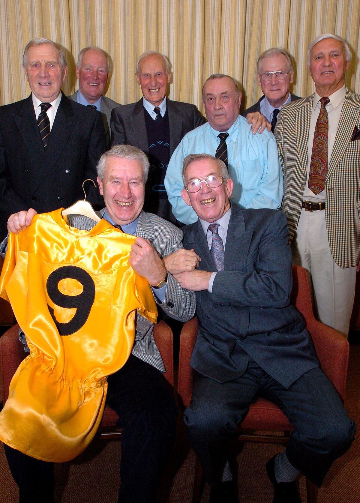 This 2004 picture from our files shows former Wolves striker Roy Swinbourne being reunited with the fluorescent shirt he wore against Honved in 1954. Seated with him are Peter Broadbent, while watching are other team members, from left, Bill Shorthouse, Ron Flowers, Bert Williams, Les Smith, Bill Slater and Eddie Stuart. 