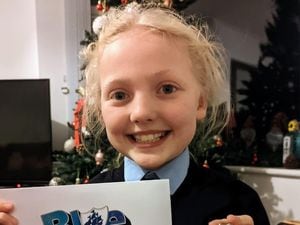 Ruby Sheffield, 9, with her Blue Peter badge