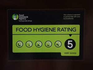 A Food Standards Agency rating sticker on a window of a restaurant. A huge variation in food hygiene standards remains across the UK, with one in five high or medium-risk food outlets failing to meet standards, according to a study.