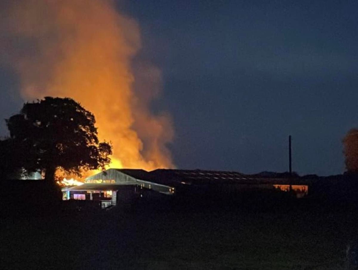 Fire crews from across county sent to huge barn fire involving '300 tonnes of hay' 