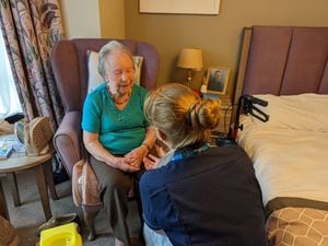 Glady Skinner, 95, resident of Priorslee House Care Home, Telford being administered her vaccine by Kate Tatton, Covid vaccine lead nurse.