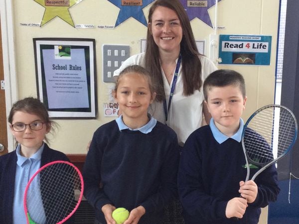 Amy Brentnall, a Year 3 teacher at Meadows Primary School, who won the prize for the school, with Year 3 pupils Jack, Caitlin and Anna, who asked tennis players Aniek van Koot and Abbie Breakwell questions.