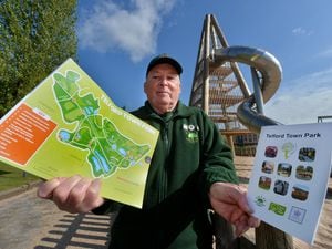 Chris Pettman, chairman of the Friends of Telford Town Park, showing off the group's new guide  