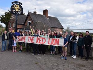Residents celebrate after the Red Lion was saved from demolition by a protection order
