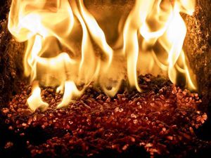 Pellets burning inside a biomass boiler