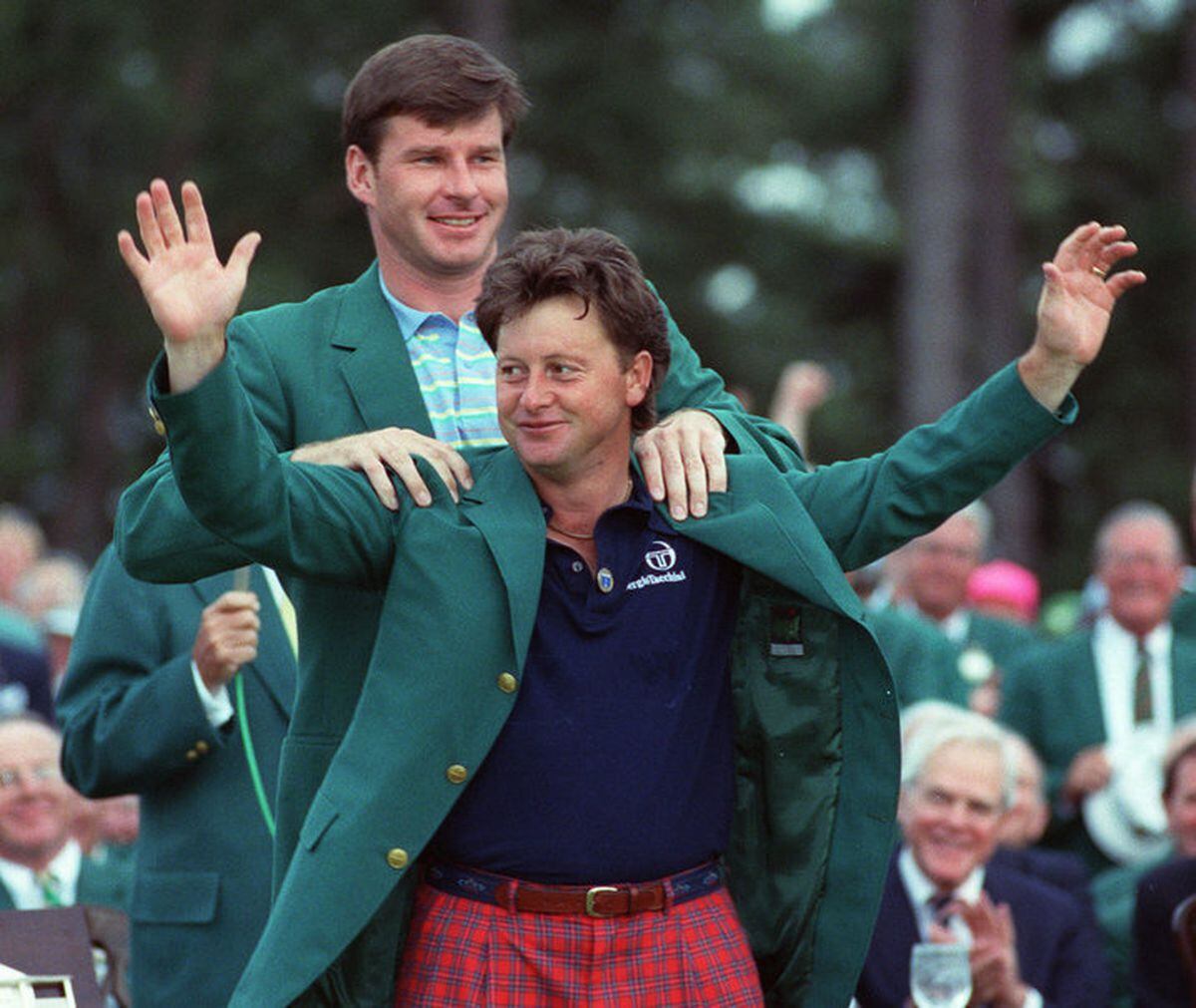 Former Masters champion Ian Woosnam marks his 1991 success by receiving the green jacket. 