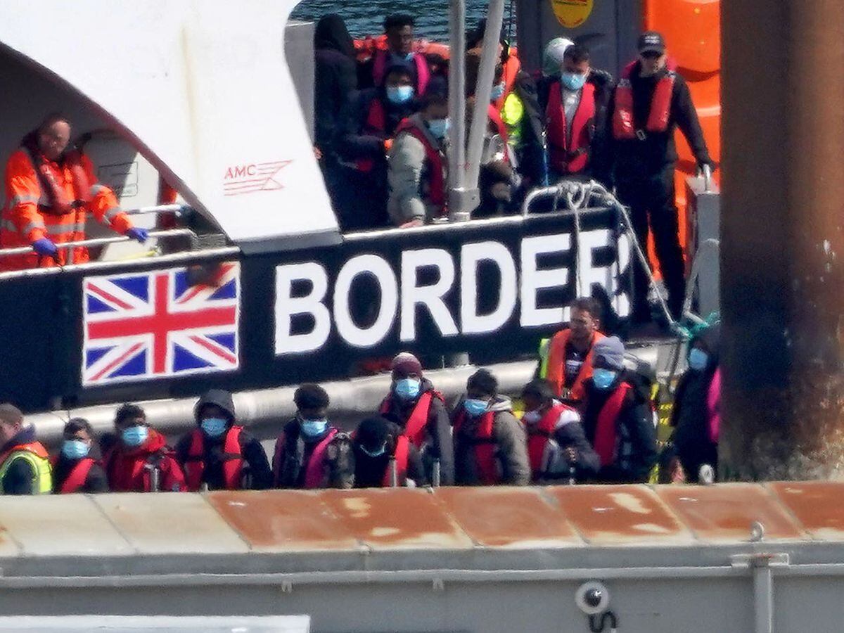 A group of people thought to be migrants are brought in to Dover