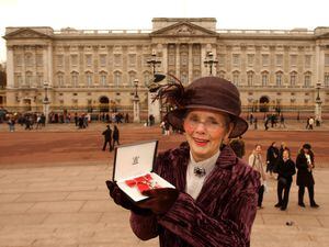 Shirley Tart, proudly showing off her MBE at Buckingham Palace in 2005, worked at the Shropshire Star for more than 60 years