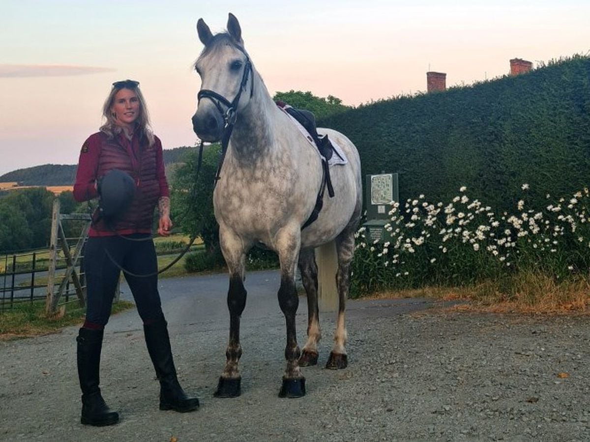 Zoe Geddes with one of the horses, Silver, in her care 