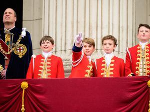 The Prince of Wales and Prince George with the King’s Pages of Honour on the balcony of Buckingham Palace following the coronation (Leon Neal/PA)