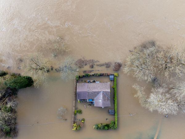 A house surrounded by flood waters
