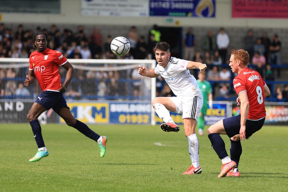 Robbie Evans of AFC Telford United and Michael Woods of York City.